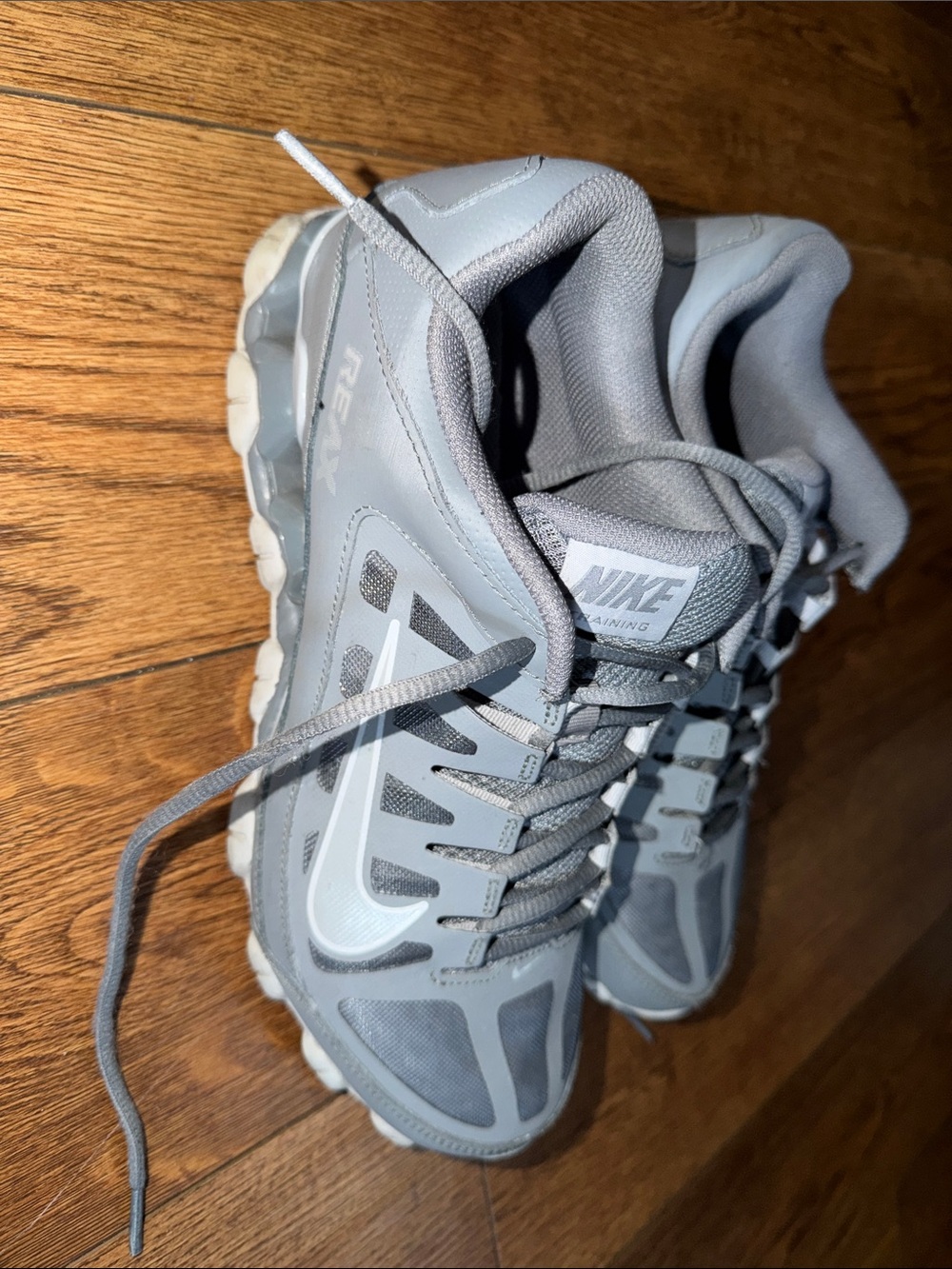 Nike Light Gray Athletic Sneakers with White Swoosh Reax.